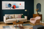 Bold abstract circles in vivid red and dark steel blue with geometric grid lines, panoramic canvas wall art