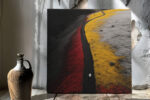 Solitary figure on winding path through vivid red, yellow, black flower fields, bold aerial digital art for living room