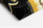 Fluid abstract paint swirls in amber gold and deep black, bold contemporary wall art canvas for living rooms