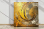 Concentric gold and silver impasto arcs spiral inward, bold abstract acrylic wall art for living room or home office