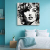 Woman's face with geometric shards and ink splatter in black and white, bold mixed-media portrait canvas wall art
