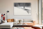 Lone silhouetted figure with long shadow in monochrome watercolor, moody minimalist canvas art for bedroom or home office