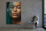 Woman's face with teal paint texture and closed eyes in deep teal and amber, moody portrait canvas for bedroom