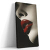 Extreme close-up portrait, vivid crimson lips on monochrome skin, bold high-contrast wall art for contemporary spaces