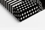 Woman's portrait emerging from monochrome patterned paper collage, bold mixed-media square wall art for living room