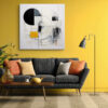 Bold abstract geometric circle and arc mixed-media wall art in cream, black and gold for a living room or home office