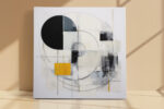 Bold abstract geometric circle and arc mixed-media wall art in cream, black and gold for a living room or home office