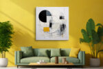 Bold abstract geometric circle and arc mixed-media wall art in cream, black and gold for a living room or home office