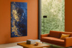 Side-profile figure with gold paint splatter on deep royal blue, bold art deco digital art canvas for living room