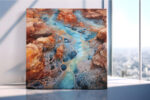 Aerial canyon waterway with vein-like rock patterns in burnt sienna and cerulean blue, digital art canvas for living room