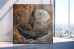 Sailing ship before a glowing orb etched with script, burnt sienna and copper mixed-media canvas wall art