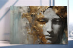Sculptural face with gold leaf fragments and grey tones, dramatic mixed-media portrait canvas for living room